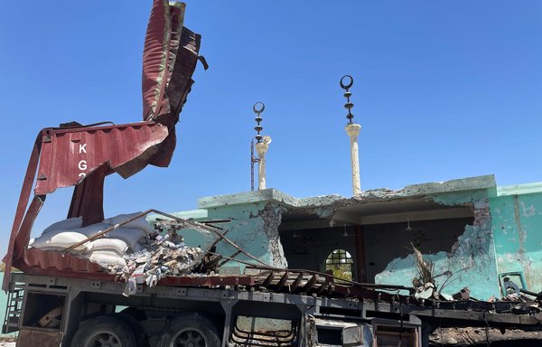 A picture taken July 8 shows a destroyed vehicle that was carrying rockets hidden among sacks of flour, in al-Baghdadi district, Anbar province. [Ayman Henna/AFP]