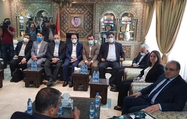 Iranian Minister of Roads and Urban Development Mohammad Eslami confers on economic matters with Syrian Minister of Economy and Foreign Trade Mohammad Samer al-Khalil in Damascus on June 19. [General Organisation for Syrian Free Zones]