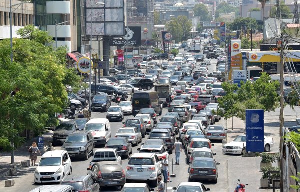 Lebanese queue for hours in front of Beirut gas stations to fill up their car tanks with a rationed amount of fuel. [Ziyad Hatem]