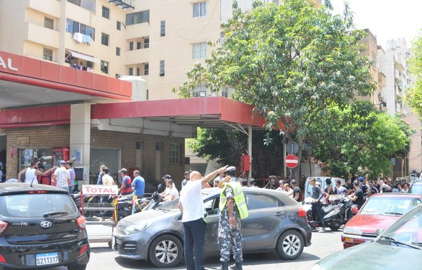 Beirut residents wait their turn to fill up their tanks with rationed gasoline. [Ziyad Hatem]