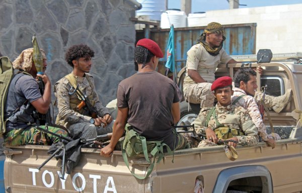Yemeni security personnel sit in a truck at the Aden airport on January 3, days after explosions blamed on the Houthis targeted cabinet members of Yemen's new government, killing at least 26 people. [Saleh Obaidi/AFP]