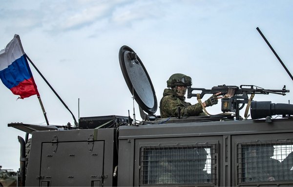 Russian forces patrol in oil fields near the town of al-Qahtaniyah, in Syria's northeastern al-Hasakeh province, on February 4. [Delil Souleiman/AFP]