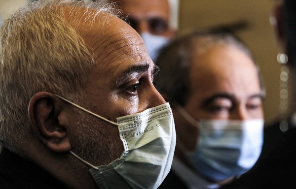 Iran's Foreign Minister Javad Zarif and Syria's Foreign Minister Faisal Mekdad speak to reporters after meeting in Damascus on May 12. [Louai Beshara/AFP]