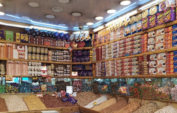 A store selling Eid nuts and raisins in Sanaa can be seen empty ahead of Eid al-Adha. [Haitham Mohammed/Al-Mashareq]