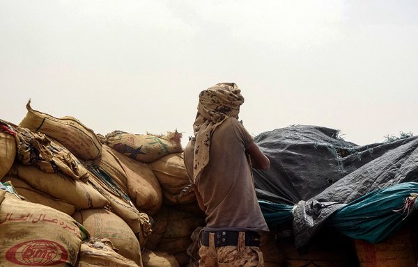 A Yemeni fighter mans a position near the frontline facing the Iran-backed Houthis in the northeastern province of Marib, on June 19. [AFP]