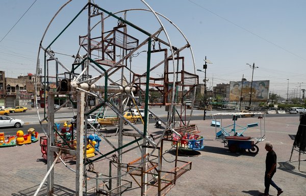 A children's playground in Baghdad's Sadr City, usually bustling during the Eid al-Adha holiday, remains empty on July 21 in the aftermath of a deadly attack claimed by ISIS. A six-member ISIS 'terror cell' has since been arrested. [Ahmad al-Rubaye/AFP]