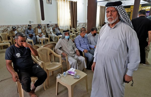 Iraqis attend a funeral for a family killed in an explosion a day earlier at a market in Baghdad's Sadr City, on July 20. ISIS claimed responsibility for the attack in which at least 36 people were killed. [Ahmad al-Rubaye/AFP]