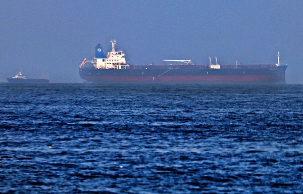 The MT Mercer Street was attacked off the port of the Gulf Emirate of Fujairah on July 29. A British security guard and a Romanian crew member were killed in what the United States and Britain said was an Iranian drone strike. [Karim Sahib/AFP]