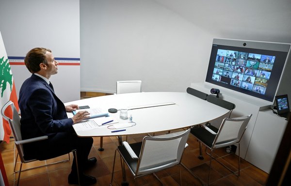 French President Emmanuel Macron attends the Lebanon donors' conference, gathering online representatives of international institutions and heads of state, one year after the Beirut port blast, on August 4. [Christophe Simon/Pool/AFP]