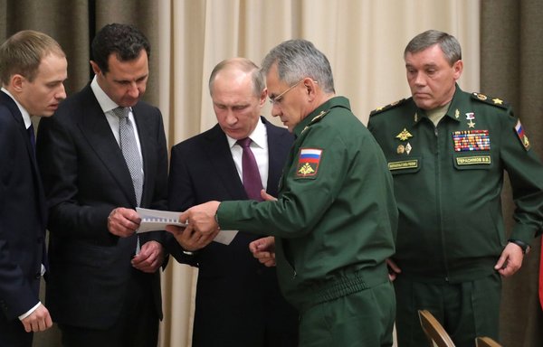 Russian President Vladimir Putin meets with Syrian President Bashar al-Assad and senior officials of the Russian Defence Ministry and Russian military General Staff in 2018 to discuss long-term plans. [Kremlin]