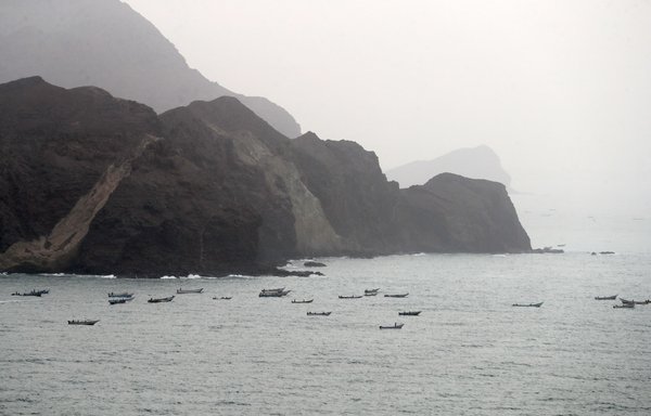 A picture taken on August 10, 2018, during a trip in Yemen organised by the UAE's National Media Council (NMC) shows a view of Yemeni fishing boats along the Yemeni side of the strategic strait of Bab al-Mandeb, which separates the Arabian Peninsula from East Africa. [Karim Sahib/AFP]