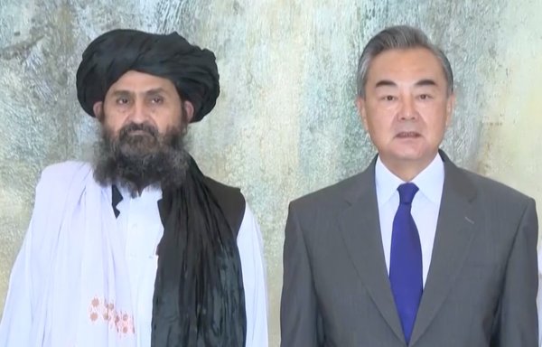 Mullah Abdul Ghani Baradar, Taliban co-founder, with Chinese foreign minister Wang Yi in late July during Taliban visit to China. [AFP]
