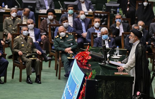 Iranian President Ebrahim Raisi speaks during his swearing in ceremony in parliament on August 5. [Atta KENARE / AFP]