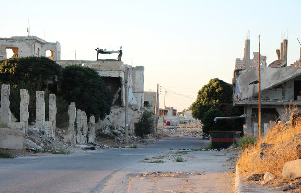 Almost half of the population of opposition-held Daraa al-Balad district has fled heavy shelling and ground battles, but the United Nations warns that remaining civilians are cut off with dwindling supplies. [Sam Hariri/AFP]