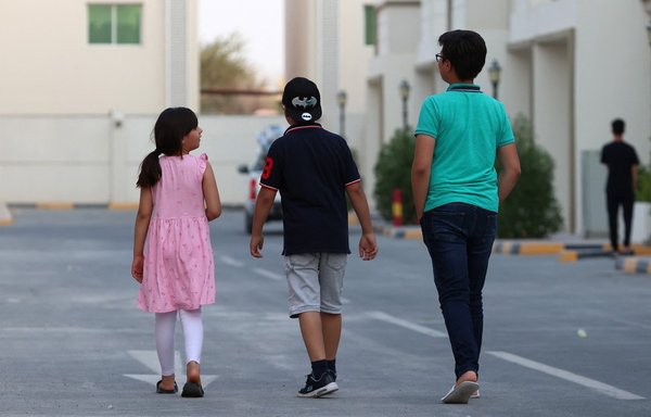A photo taken August 21 shows Afghan youths inside a villa complex near the centre of the Qatari capital Doha, where refugees who recently arrived from Afghanistan began to settle, following their exodus from their country. [Karim Jaafar/AFP]