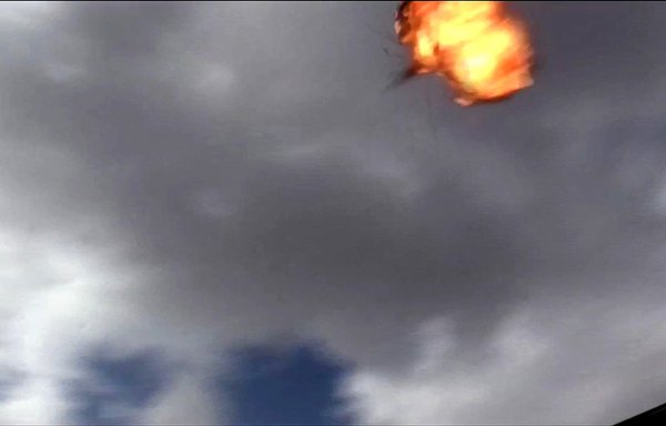 An image grab taken from a video obtained by AFPTV shows the moment a drone exploded above Yemen's al-Anad air base in in the government-held southern province of Lahj on January 10, 2019. [Nabil Hasan/AFPTV/AFP]