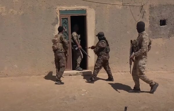 SDF forces conduct a raid in western rural Deir Ezzor in August. [Syrian Democratic Forces]