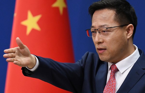 Chinese Foreign Ministry spokesman Zhao Lijian takes a question in Beijing. Zhao has been one of the Chinese regime's main sources of disinformation. [Greg Baker/AFP]