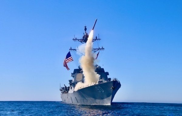 The guided-missile destroyer USS Chafee launches a Block V Tomahawk, the weapon's newest variant, during a missile exercise in the Pacific Ocean on December 1. [US Navy]