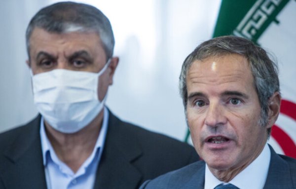 Iranian Atomic Energy Agency chief Mohammad Eslami (left) is shown with IAEA chief Rafael Grossi in Tehran September 12. [ISNA]