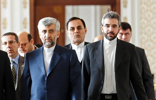 In this file photo from January 22, 2011, Iran's then-chief nuclear negotiator Saeed Jalili (front left), accompanied by his deputy Ali Bagheri, arrives for talks in Istanbul. Bagheri, a protege of Iranian President Ebrahim Raisi, has been named Iran's new chief nuclear negotiator. [Salih Zaki Fazlioglu/Pool/AFP]