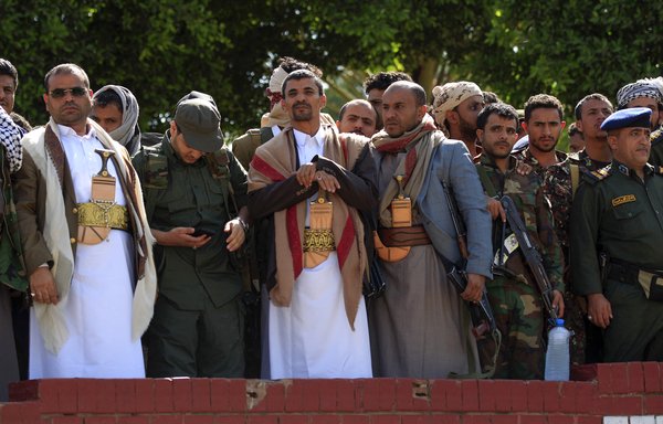 Houthi military commander Abdullah al-Hakim (centre) attends the execution of eight men and a boy in a public square in Sanaa on September 18. [Mohammed Huwais/AFP]
