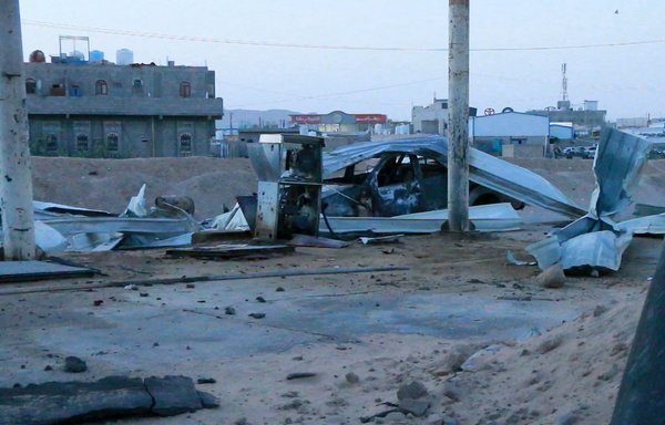 This picture taken June 5 shows a destroyed vehicle at the scene of a Houthi missile strike on a gas station in Marib city that killed at least 14 civilians. [AFP]