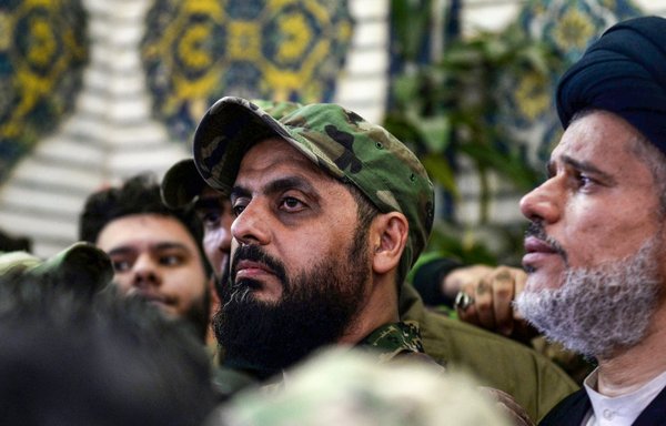 Asaib Ahl al-Haq leader Qais al-Khazaali attends the funeral procession of Iraqi paramilitary chief Abu Mahdi al-Muhandis and IRGC Quds Force commander Qassem Soleimani in Najaf on January 4, 2020. [Haidar Hamdani/AFP]