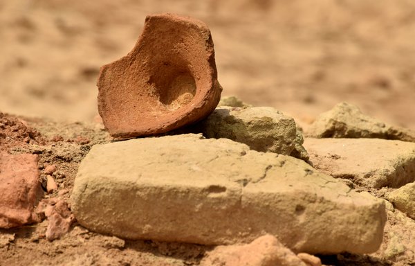 Pottery and other ancient fragments are scattered in the open air at the Tell al-Ubayd archaeological site, to the west of the remains of the ancient city of Ur in Iraq's Dhi Qar province, on August 7. Iraq has launched a campaign to protect its archaeological sites from looting and destruction. [Asaad Niazi/AFP]