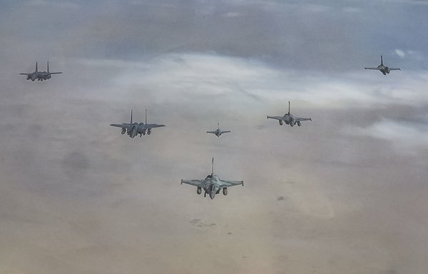 US fighter jets fly in formation with Qatar aircraft while participating in the Sky Shield exercise on March 2. [US Air Force]