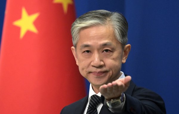Chinese Foreign Ministry spokesman Wang Wenbin takes a question in Beijing November 9. [Greg Baker/AFP]