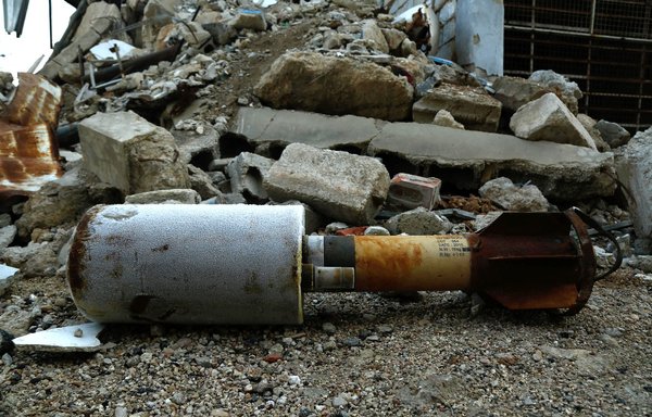 A close up shot shows an empty rocket reportedly fired by Syrian regime forces on the town of Douma in Eastern Ghouta, outside Damascus, on January 22, 2018. [Hasan Mohamed/AFP]