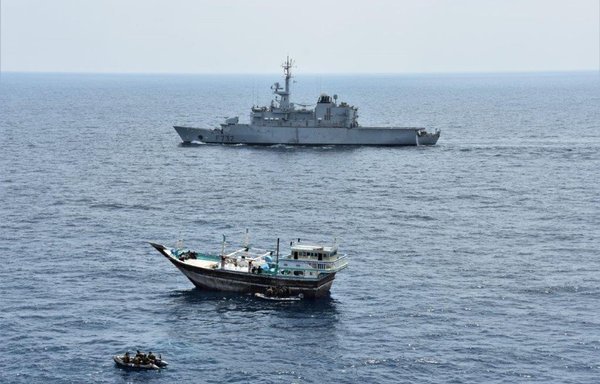 Boarding teams from the French frigate FS Nivôse on the Arabian Sea approach a suspicious dhow leading to the capture of 677kg of methamphetamine and heroin on March 19. [Combined Maritime Forces]