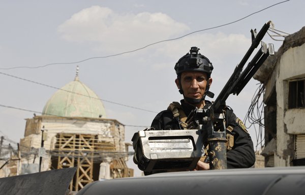 A member of the Iraqi security forces stands guard at al-Nuri mosque in the Iraqi city of Mosul, ahead of a visit by French President Emmanuel Macron, on August 29. [Ludovic Marin/AFP]