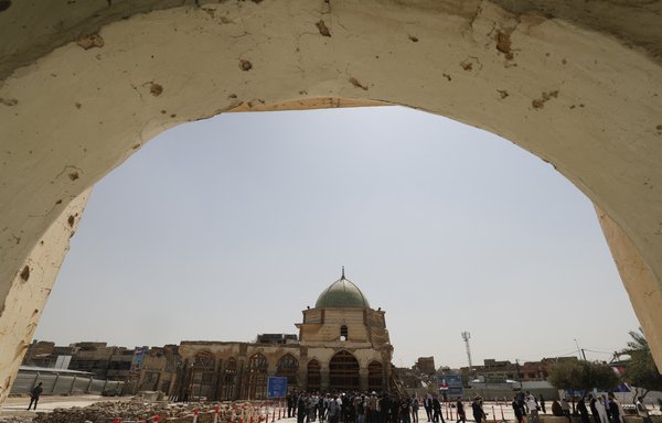 Al-Nuri mosque seen here during the visit of French President Emmanuel Macron (unseen) in the Ninawa province city of Mosul on August 29. [Ahmad al-Rubaye/AFP]