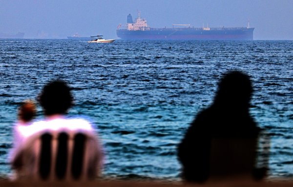 The MT Mercer Street is seen off the port of Fujairah in the United Arab Emirates on August 3. On July 29, two crew members of the tanker were killed in what was determined to be a drone attack off Oman. [Karim Sahib/AFP]