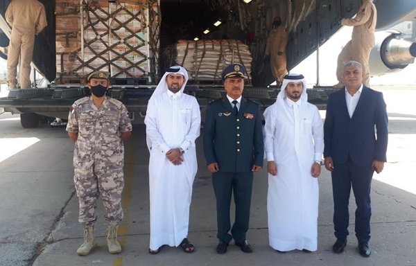Lebanese and Qatari officials at Beirut airport pose for a photograph as Qatari aid is delivered to the Lebanese army in September. [Qatari Foreign Ministry]