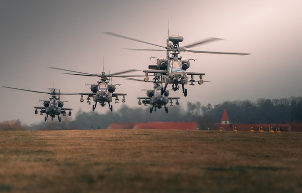 AH-64 Apache attack helicopters of the 12th Combat Aviation Brigade launch from Katterbach Army Airfield in Germany for a battalion attack training mission during Operation Eminent Strike on March 17. [CENTCOM]