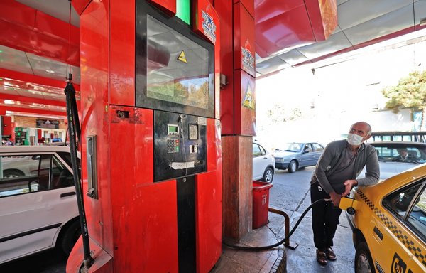 This photo of a gas station in Tehran was taken October 27, amid a cyber attack that caused unprecedented disruption to the country's fuel distribution network. [Atta Kenare/AFP]