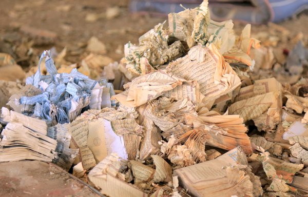 Destroyed religious books are seen at a mosque south of Marib following a Houthi missile strike that killed at least 22 people, including children. [AFP]
