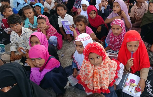 Displaced Yemeni children attend class in a dilapidated school building in the war-torn western province of al-Hodeidah on September 5. [Khaled Ziad/AFP]