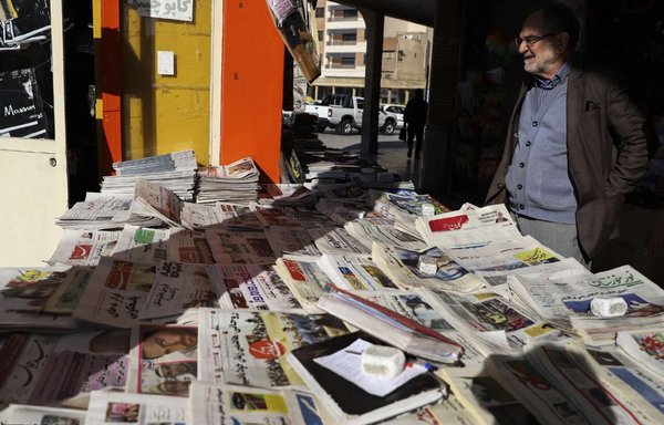 A man stands at a newspaper stand in Tehran in November. Even the slightest criticism of the Iranian regime can put a publication's licence in jeopardy. [IRNA]