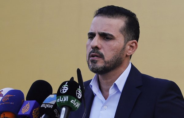 Kataib Hizbullah spokesman Abu Ali al-Askari speaks during a campaign rally in Baghdad on September 3, ahead of the parliamentary elections, in which the militia's political bloc later suffered a resounding defeat. [Ahmad al-Rubaye/AFP]