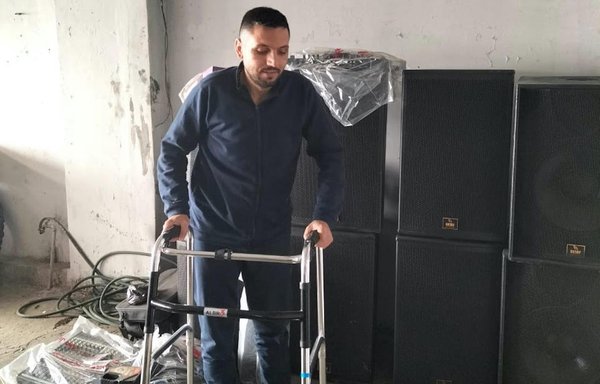 Sound engineer Danny Salameh prepares to reopen his shop, after receiving new equipment donated by USAID. [Danny Salameh]