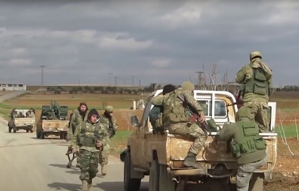 Tahrir al-Sham elements prepare for battle in northwestern Syria's Idlib province. [Ebaa News Agency via Syria TV]