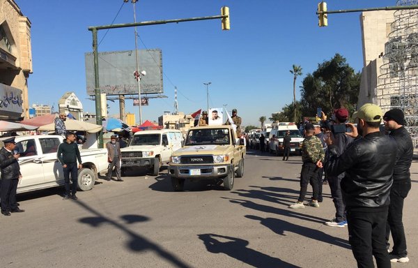 Asaib Ahl al-Haq and its followers hold a show of force parade in Baghdad's Tahrir Square on December 26, 2020. [Iraqnewspaper.net]