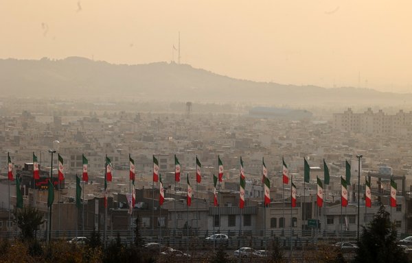 Smog engulfs buildings in Tehran on November 22. Tehran's air pollution is reaching hazardous levels again as authorities are urging the elderly and sick as well as children to stay indoors. [Atta Kenare/AFP]