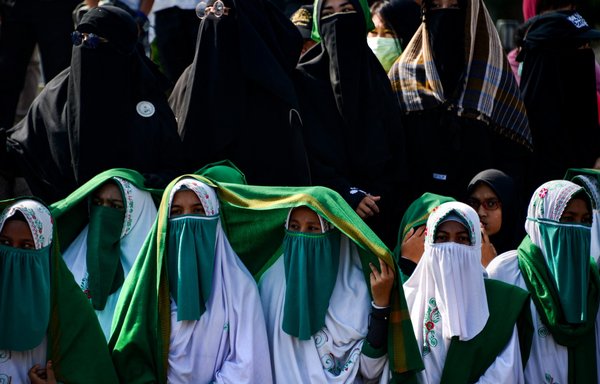 Members of the Islamic Defender Front (FPI) participate in a rally in Indonesia in 2019 to show support for oppressed Muslims in China. [Chaideer Mahyuddin/AFP]