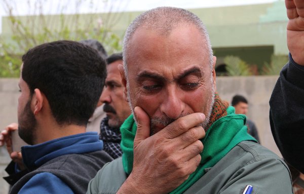 Iraqi Sameer Wais reacts on March 11, 2016, during the funeral of his 3-year-old daughter, Fatima, who was killed following an ISIS chemical attack against the town of Taza, south of Kirkuk. [Marwan Ibrahim/AFP]