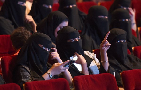 Saudi women attend the 'Short Film Competition 2' festival on October 20, 2017, at King Fahad Culture Centre in Riyadh. [Fayez Nureldine/AFP]
